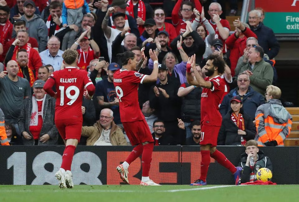 Soccer Football - Premier League - Liverpool v Nottingham Forest - Anfield, Liverpool, Britain - October 29, 2023 Liverpool's Mohamed Salah celebrates scoring their third goal with Darwin Nunez and Harvey Elliott. Photo: Reuters